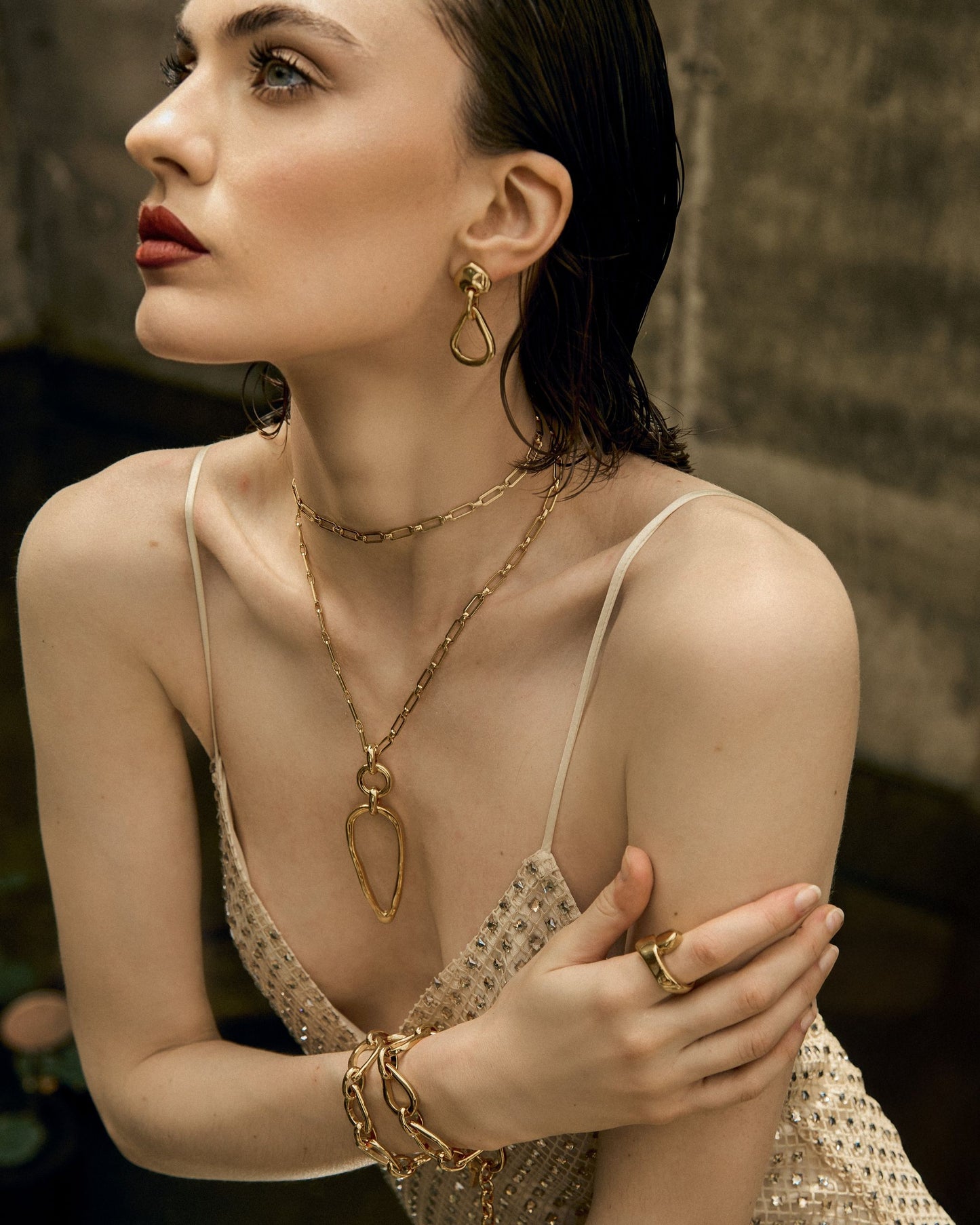 
                  
                    Model styling small teardrop earrings with 24k gold  jewelry by Vidda Jewelry.
                  
                