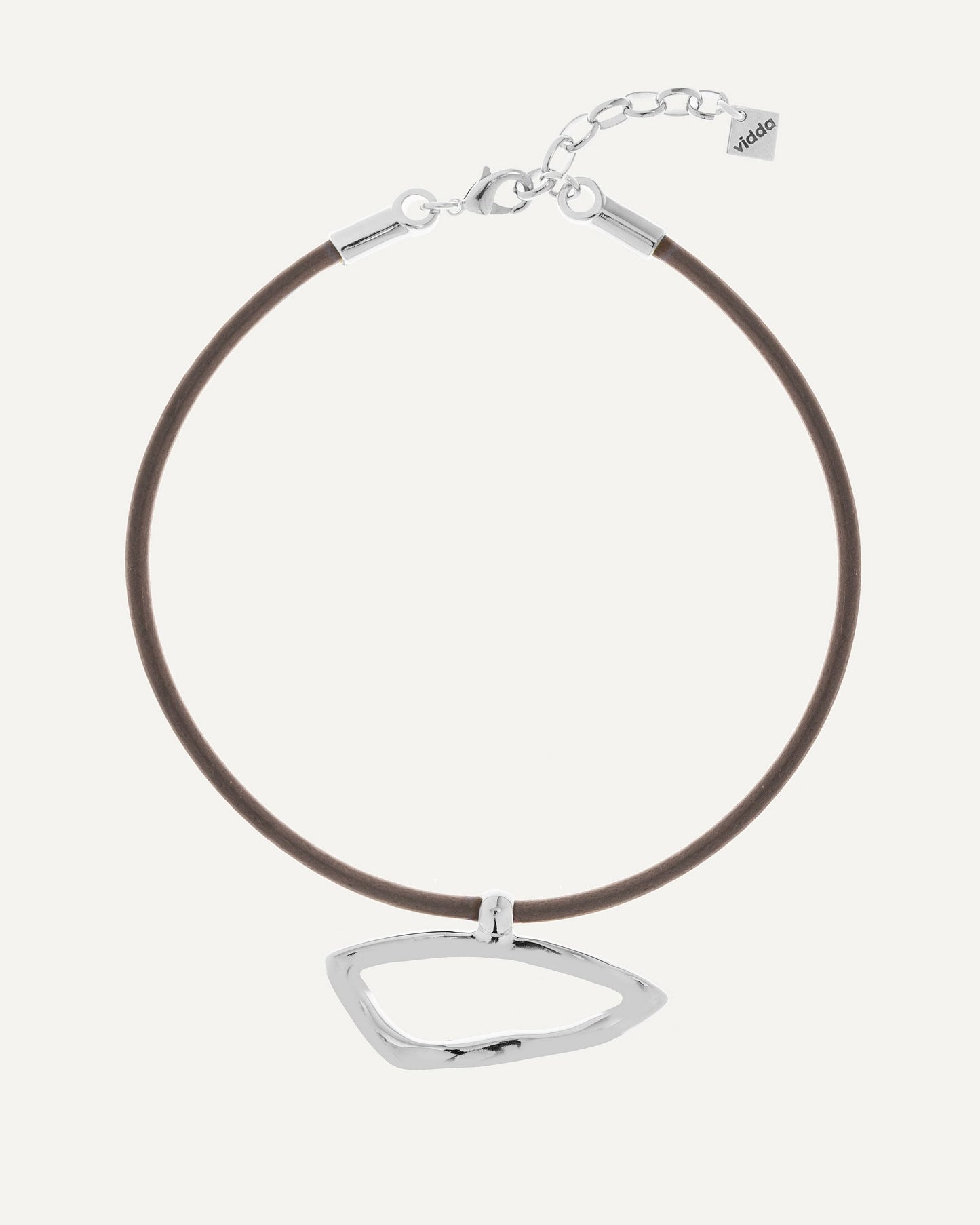 Leather necklace with organic geometric pendant in sterling silver finish. Vidda Jewelry product photo.