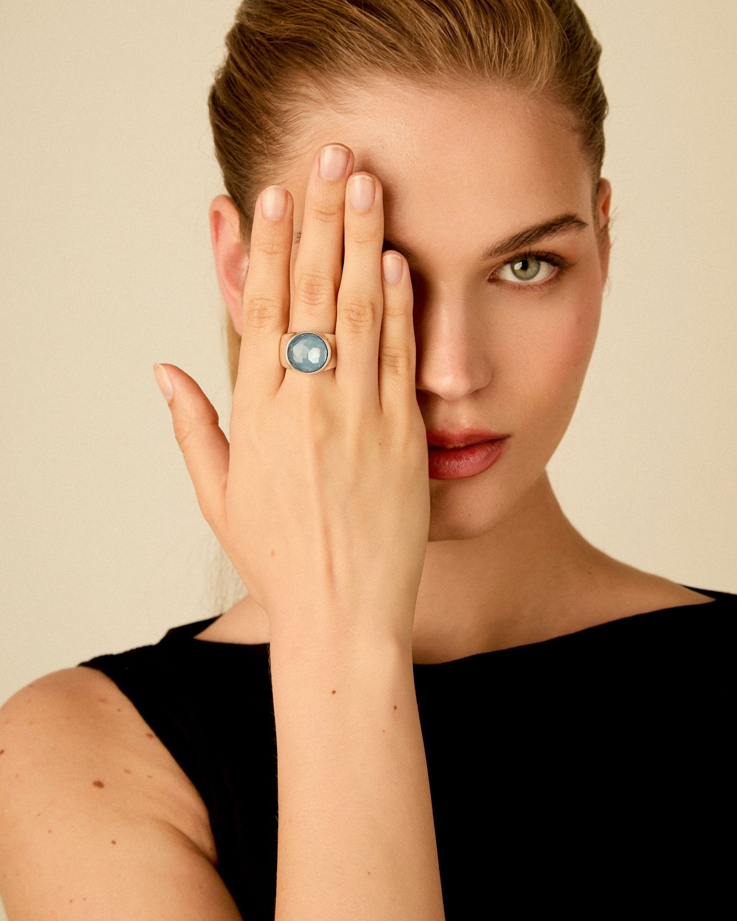 Model wearing sterling silver plated signet ring with Swarovski crystal for an elegant look