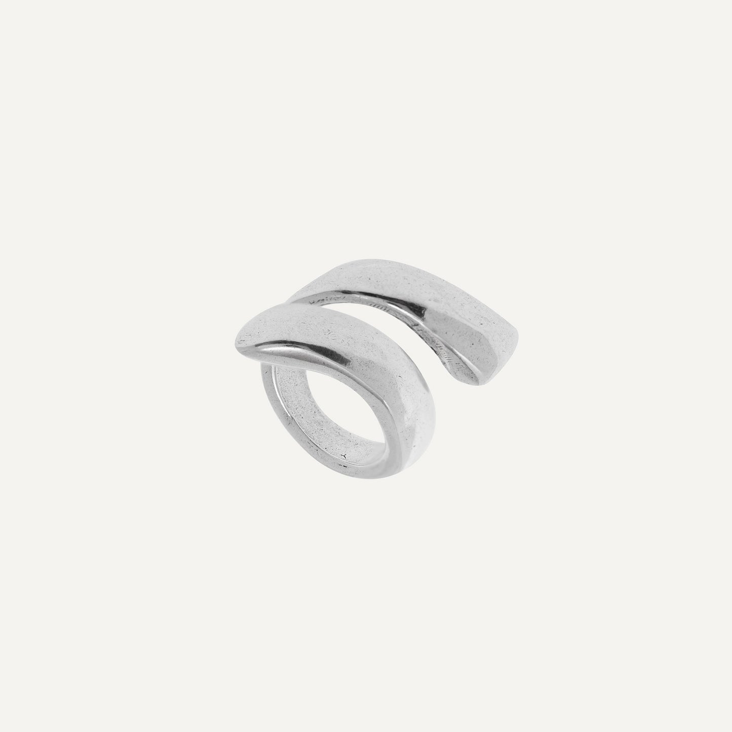 A silver, curved open women���������s ring with square edges.